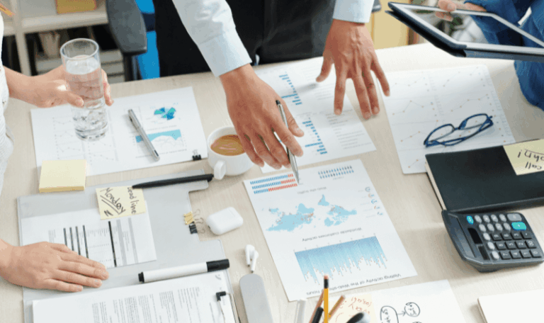 Utility auditing for finance departments with CFO team analyzing utility cost reports, billing data, and budget forecasts