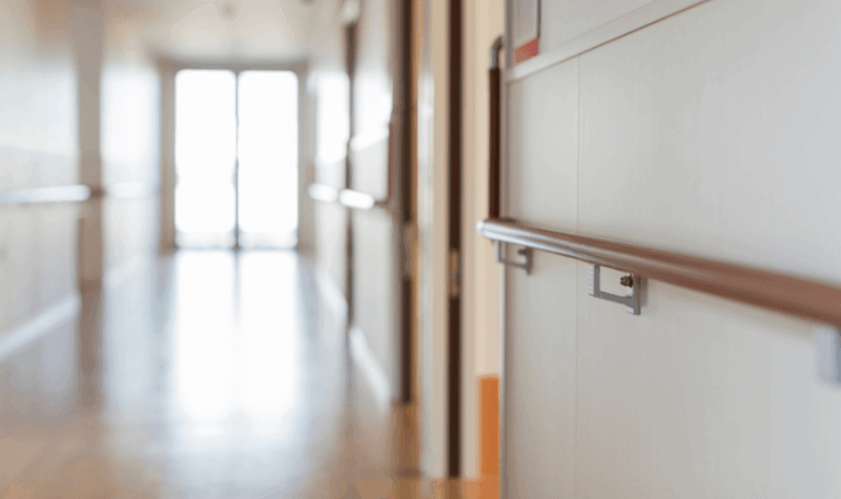 Utility Audits for Long-Term Care Facilities helping nursing homes reduce energy costs in modern facility corridors